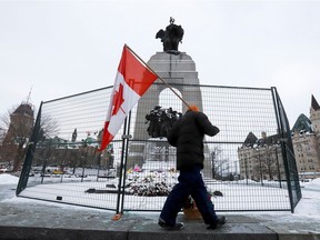 The National War Memorial and the Tomb of the Unknown Soldier sit behind barricades as truckers and supporters continue to protest COVID-19 vaccine mandates in Ottawa on Feb. 4, 2022.