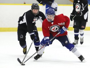 Players take part in a scrimmage at the Hockey Canada Skills Academy at the Garson Arena in Garson, Ont.