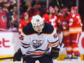 Kailer Yamamoto (56) of the Edmonton Oilers reacts after Oliver Kylington (58) of the Calgary Flames scored at Scotiabank Saddledome on March 26, 2022, in Calgary.