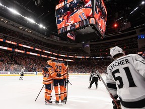 Edmonton Oilers forward Leon Draisaitl (29) celebrates a goal with teammates, his 49th of the season, on L.A. Kings’ goaltender Jonathan Quick (32) at Rogers Place in Edmonton on Wednesday, March 30, 2022.