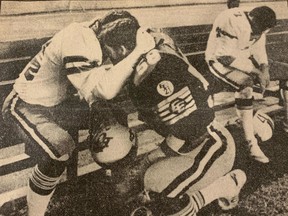 Steve Kearns, left, of the B.C. Lions is consoled by his twin brother, Dan, of the Edmonton Elks after the two met in the Canadian Football League West Division final in this newspaper cutout from Nov. 16, 1981.