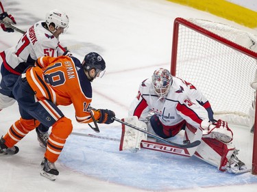 Edmonton Oilers Zach Hyman (18) can't get the puck past Washington Capitals Ilya Samsonov (30) during first period NHL action on Wednesday, March 9, 2022 in Edmonton.