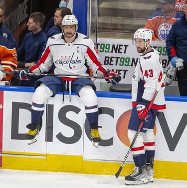 Washington Capitals Alex Ovechkin (8) and Tom Wilson (43) wait for play to resume against the Edmonton Oilers during first period NHL action on Wednesday, March 9, 2022 in Edmonton.