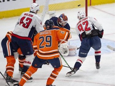 Washington Capitals Evgeny Kuznetsov (92) fires the puck just wide of Edmonton Oilers goalie Mikko Koskinen (19) during first period NHL action on Wednesday, March 9, 2022 in Edmonton.