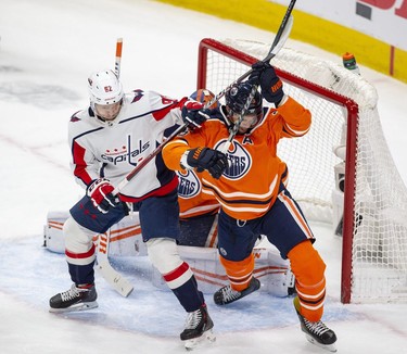 Edmonton Oilers Darnell Nurse (25) battles with Washington Capitals Evgeny Kuznetsov (92) during second period NHL action on Wednesday, March 9, 2022 in Edmonton.