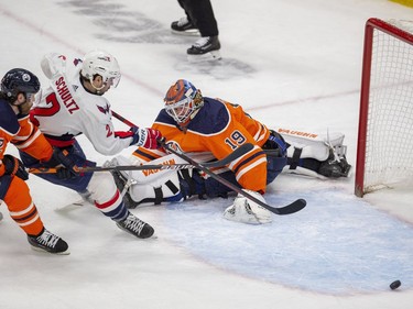 Edmonton Oilers goalie Mikko Koskinen (19) makes a save on Washington Capitals Justin Schultz (2) during second period NHL action on Wednesday, March 9, 2022 in Edmonton.