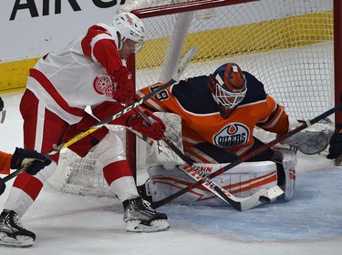 Edmonton Oilers goalie Mikko Koskinen (19) makes the save on Detroit Red Wings Jakub Vrana (15) during NHL action at Rogers Place in Edmonton, March 15, 2022.