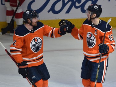 Edmonton Oilers Connor McDavid (97) celebrates his goal with Duncan Keith (2) against the Detroit Red Wings during NHL action at Rogers Place in Edmonton, March 15, 2022.