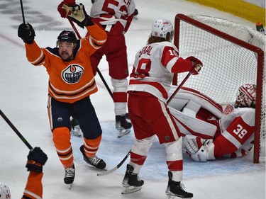 Edmonton Oilers Devin Shore (14) celebrates Warren Foegele (37) goal late in the third period Detroit Red Wings goalie Alex Nedeljkovic (39) which turned out to the winning goal during NHL action at Rogers Place in Edmonton, March 15, 2022.