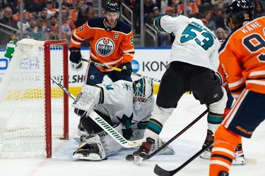Edmonton Oilers' Evander Kane (91) is stopped by San Jose Sharks' goaltender Kaapo Kahkonen (34) during first period NHL action at Rogers Place in Edmonton, on Thursday, March 24, 2022.
