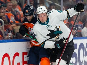 Edmonton Oilers' Derick Brassard (16) battles San Jose Sharks' Nicolas Meloche (53) at Rogers Place in Edmonton March 24, 2022.