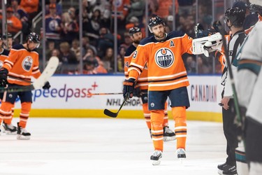 Edmonton Oilers' Leon Draisaitl (29) celebrates a goal with teammates on San Jose Sharks' goaltender Kaapo Kahkonen (34) during second period NHL action at Rogers Place in Edmonton, on Thursday, March 24, 2022.