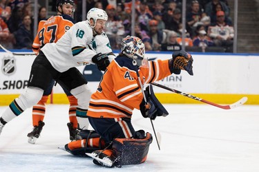 Edmonton Oilers' goaltender Mike Smith (41) makes a save in front ofg San Jose Sharks' Tomas Hertl (48) during second period NHL action at Rogers Place in Edmonton, on Thursday, March 24, 2022.