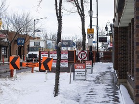 EDMONTON ALBERTA: MARCH 26, 2022. Fencing and signage along 118 Ave on March 26, 2022. Four businesses have seen their revenue almost 100% disappear due to street frontage and signage completely blocked off by fencing and scrim along 118 ave. Jason Franson for Postmedia