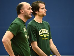 University of Alberta Golden Bears men's volleyball team associate coach, Brock Davidiuk, right, with then-head coach Terry Danyluk appear in this file photo taken during team practice at the Saville Centre in Edmonton, Feb. 17, 2016.