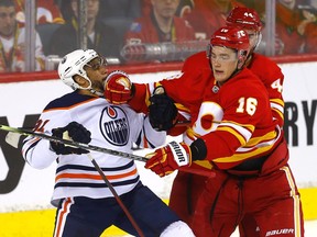 Calgary Flames Nikita Zadorov battles Edmonton Oilers Evander Kane in second period NHL action at the Scotiabank Saddledome in Calgary on Monday, March 7, 2022.