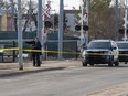 Police tape surrounds an area near the LRT crossing on 95 Street near 105 Avenue on Friday,March 25, 2022 in Edmonton.