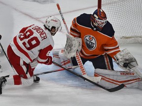 Edmonton Oilers goalie Mikko Koskinen (19) makes the glove save off Detroit Red Wings Sam Gagner (89) during NHL action at Rogers Place in Edmonton, March 15, 2022.