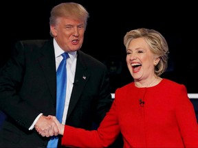 Republican U.S. presidential nominee Donald Trump shakes hands with Democratic U.S. presidential nominee Hillary Clinton at the conclusion of their first presidential debate at Hofstra University in Hempstead, New York, U.S., September 26, 2016.