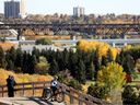 A cyclist stops to look at the fall colours in Edmonton's river valley on Oct. 1, 2021.
