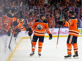 Kris Russell (6) and Zach Hyman (18) of the Edmonton Oilers celebrate a goal against the Colorado Avalanche at Rogers Place on April 22, 2022, in Edmonton.