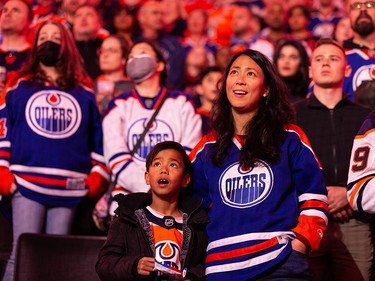 Edmonton Oilers fans sing the national anthem as the team plays the San Jose Sharks during a NHL game at Rogers Place in Edmonton, on Thursday, April 28, 2022.