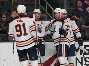 Edmonton Oilers celebrate the goal scored by center Connor McDavid (97) against the Los Angeles Kings in the first period at Crypto.com Arena on April 7, 2022.
