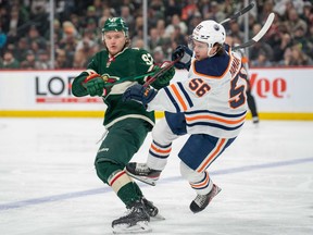 Minnesota Wild left wing Kirill Kaprizov (97) upends Edmonton Oilers right wing Kailer Yamamoto (56) at Xcel Energy Center on Tuesday, April 12, 2022.