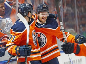 The Edmonton Oilers celebrate a goal by forward Warren Foegele (37) against the Vegas Golden Knights at Rogers Place on Saturday, April 16, 2022, in Edmonton.