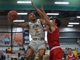 University of Alberta Golden Bears guard Tyus Jefferson (3) goes up for the shot against McGill Redbirds guard Cameron Elliot (5) during the 2022 U Sports Final Eight tournament at the Saville Community Sports Centre in Edmonton on April 1, 2022.