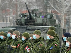 Canadian troops of NATO-enhanced Forward Presence battle group attend a meeting with Canadian Defence Minister Anita Anand in Adazi, Latvia Feb. 3, 2022.