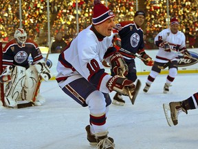 Hockey icon Guy Lafleur chases the puck at the Heritage Classic hockey game held outdoors at Commonwealth Stadium in Edmonton on November 22, 2003. The former Montreal Canadien has died at the age of 70.