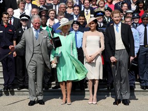 From left to right: Prince Harry, Duke of Sussex, Prince Charles, Prince of Wales, Camilla, Duchess of Cornwall, Meghan, Duchess of Sussex and guests pose for a photograph as they attend The Prince of Wales' 70th Birthday Patronage Celebration held at Buckingham Palace on May 22, 2018 in London.