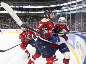 Edmonton Oil Kings forward Jalen Luypen (23) collides with the Lethbridge Hurricanes' Joe Arntsen (7) on March 27, 2022, at Rogers Place. The two teams will face each other for the first time in Western Hockey League post-season play on Thursday, April 21, 2022.