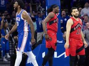 Philadelphia 76ers centre Joel Embiid (21) reacts in front of Toronto Raptors guard Fred VanVleet (23) after a score and one during the second quarter of game one of the first round for the 2022 NBA playoffs at Wells Fargo Center.