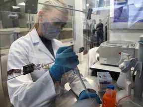 A molecular Biologists prepares samples during the site visit by representatives of the Medicines Patent Pool, France and other European Union member states, at the Centre for Educational Research and Innovation (CERI) in Cape Town, South Africa, February 4, 2022.