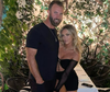PGA star Dustin Johnson and hockey heiress Paulina Gretzky are pictured in a photo posted to her Instagram on Dec. 21, 2021.