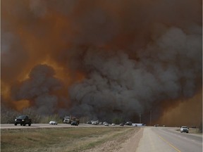 Residents of Fort McMurray flee southbound on Highway 63 after wildfires forced the evacuation of the city in May 2016.