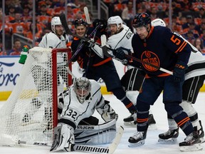 Edmonton Oilers' Cody Ceci (5) battles for position in front of L.A. Kings' goaltender Jonathan Quick (32) during first period NHL action in Game 2 of their first round Stanley Cup playoff series in Edmonton, on Wednesday, May 4, 2022.