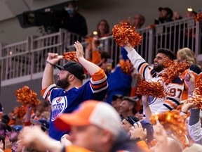 Edmonton Oilers fans cheer as the team battles the L.A. Kings during first period NHL action in Game 2 of their first round Stanley Cup playoff series in Edmonton, on Wednesday, May 4, 2022.