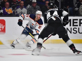 Edmonton Oilers centre Connor McDavid (97) moves the puck against Los Angeles Kings defenceman Mikey Anderson (44) in Game 4 of the first round of the 2022 Stanley Cup playoffs at Crypto.com Arena on Sunday, May 8, 2022.