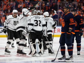 The Los Angeles Kings celebrate a 5-4 victory over the Edmonton Oilers in overtime in Game Five of the First Round of the 2022 Stanley Cup Playoffs at Rogers Place on May 10, 2022 in Edmonton, Canada.