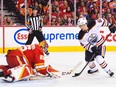 Kailer Yamamoto #56 of the Edmonton Oilers takes a shot on Jacob Markstrom #25 of the Calgary Flames during the first period of Game Two of the Second Round of the 2022 Stanley Cup Playoffs at Scotiabank Saddledome on May 20, 2022.