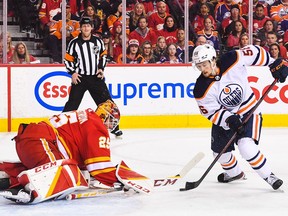 ailer Yamamoto #56 of the Edmonton Oilers takes a shot on Jacob Markstrom #25 of the Calgary Flames during the first period of Game Two of the Second Round of the 2022 Stanley Cup Playoffs at Scotiabank Saddledome on May 20, 2022.