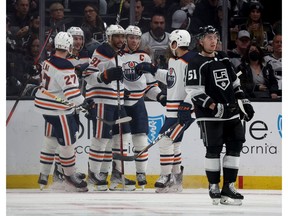 Evander Kane #91 of the Edmonton Oilers celebrates his goal with Connor McDavid #97, Zach Hyman #18 and Brett Kulak #27, behind Troy Stecher #51 of the Los Angeles Kings, to take a 2-0 lead, during the second period in Game 6 of the First Round of the 2022 Stanley Cup Playoffs at Crypto.com Arena on May 12, 2022 in Los Angeles, California.