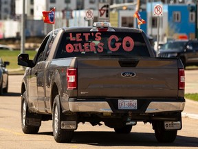An Oilers fan drives their truck around downtown ahead of Game 7 of the team's series with the L.A. Kings in Edmonton, on Saturday, Nov. 14, 2022.