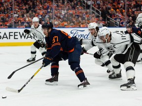 Edmonton Oilers' Connor McDavid (97) battles L.A. Kings' Anze Kopitar (11) during first period NHL Stanley Cup playoffs action at Rogers Place in Edmonton, on Saturday, May 14, 2022.