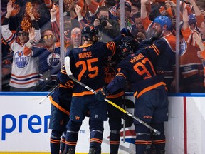 Edmonton Oilers' Cody Ceci (5) celebrates a goal with teammates on L.A. Kings' goaltender Jonathan Quick (32) during second period NHL Stanley Cup playoffs action at Rogers Place in Edmonton, on Saturday, May 14, 2022.