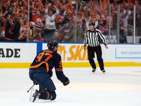 Edmonton Oilers' Connor McDavid (97) celebrates a goal with teammates on L.A. Kings' goaltender Jonathan Quick (32) during third period NHL Stanley Cup playoffs action at Rogers Place in Edmonton, on Saturday, May 14, 2022. Photo by Ian Kucerak