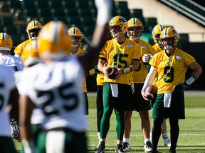 Quarterbacks Taylor Cornelius (15) and Nick Arbuckle (9) warm up during the first day of Edmonton Elks training camp at Commonwealth Stadium in Edmonton on Sunday, May 15, 2022.